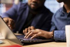 African American man and woman sits at a stylish home office